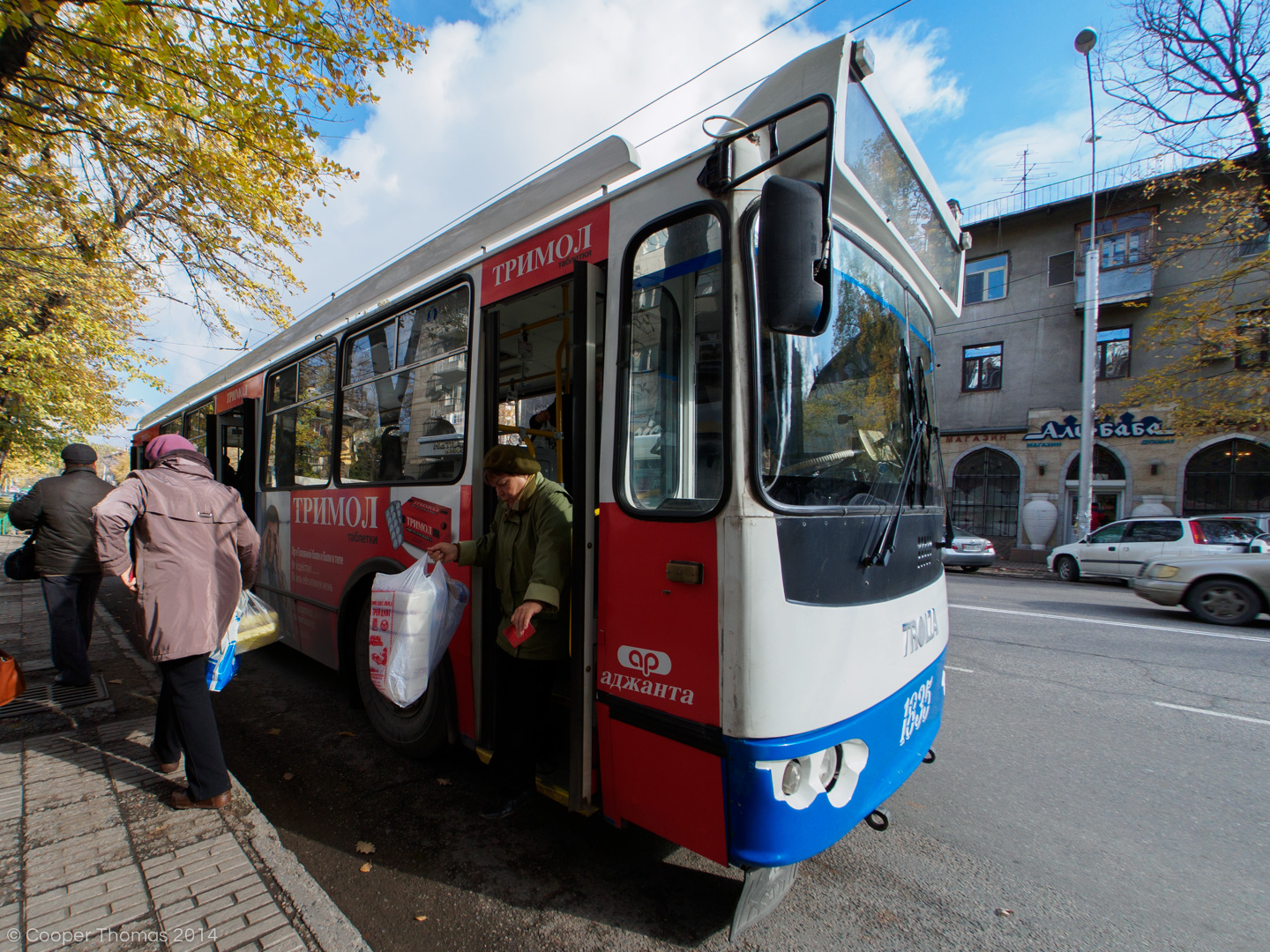 Babushkas disembark from a tram