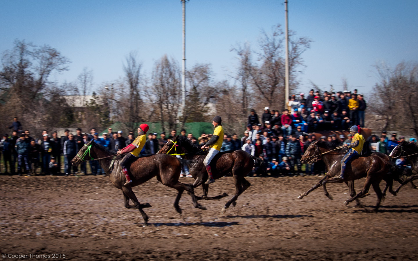 Young riders struggle to control their horses in the first race of the day