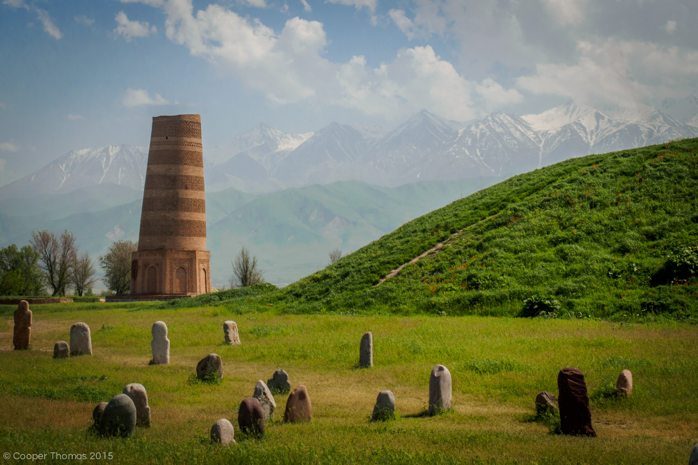 Burana Tower in spring, with burial stelae in the foreground